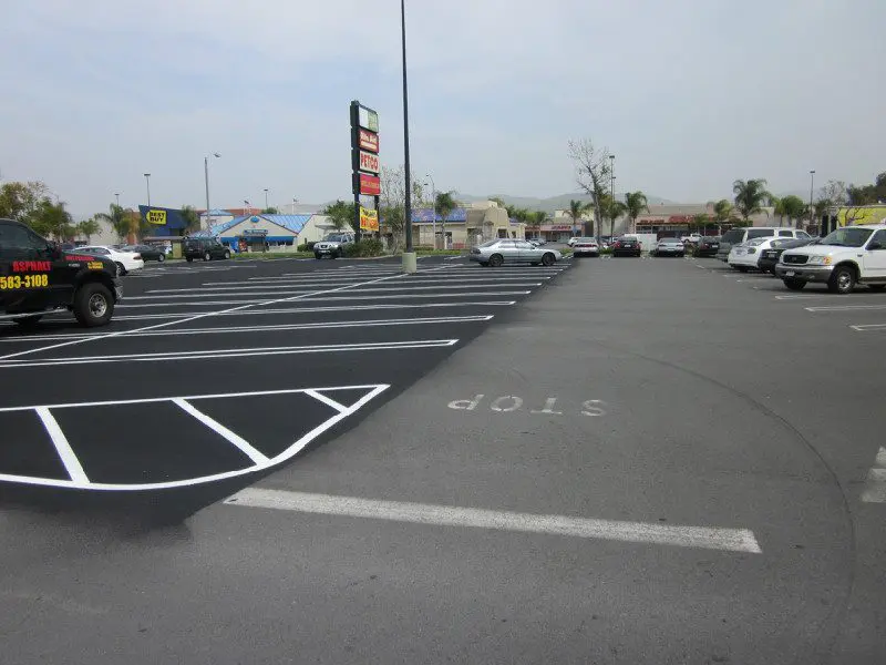 A parking lot with cars parked in it.